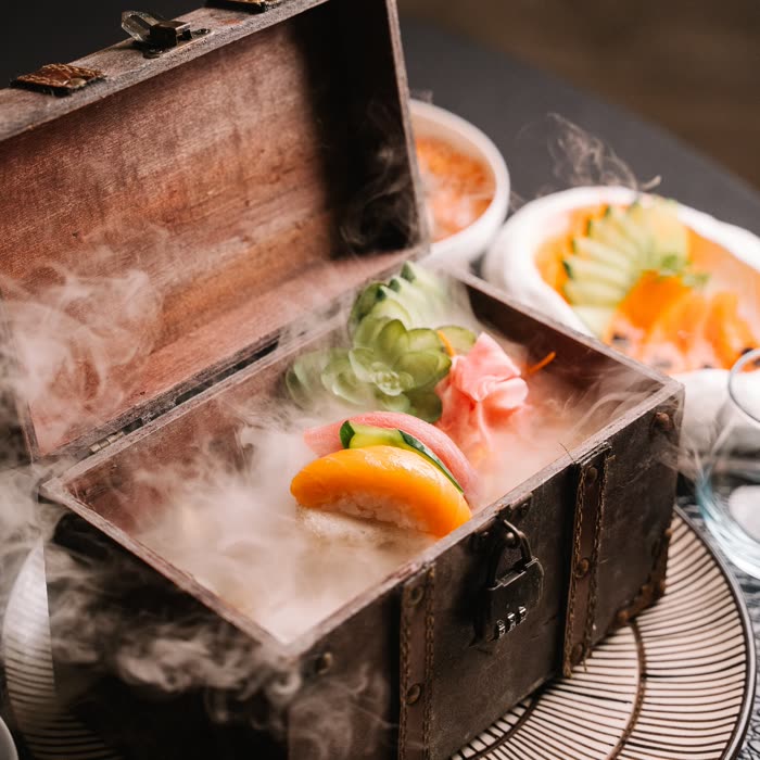 A course presented in a dark wooden box