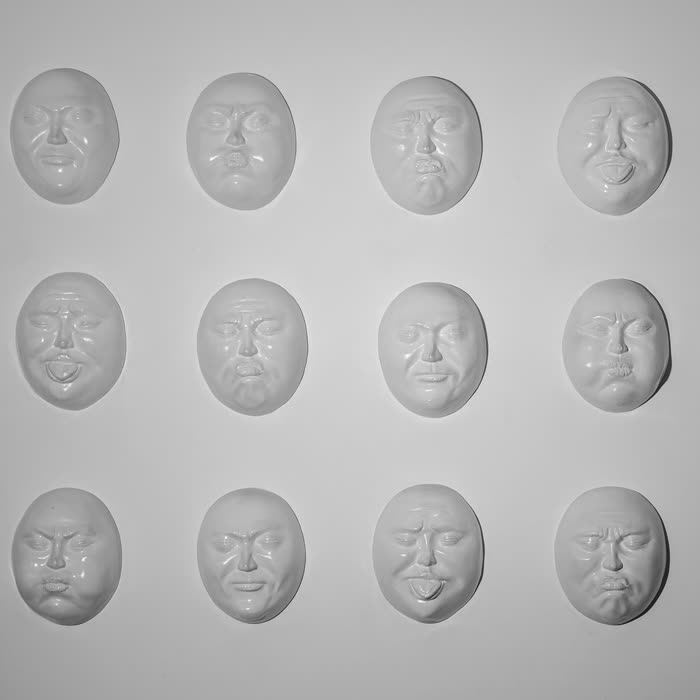The wall of sculpted faces in the Art Room