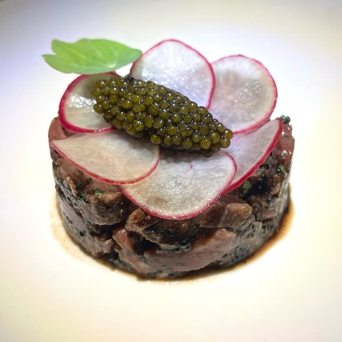 Caviar over thinly sliced radish